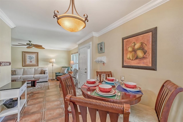 dining room with ceiling fan and crown molding