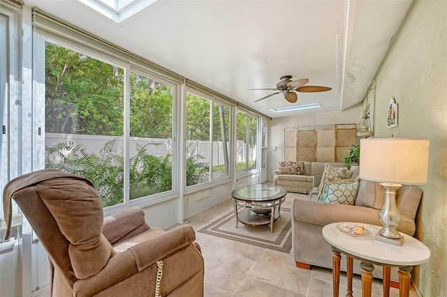 sunroom / solarium with a skylight and ceiling fan