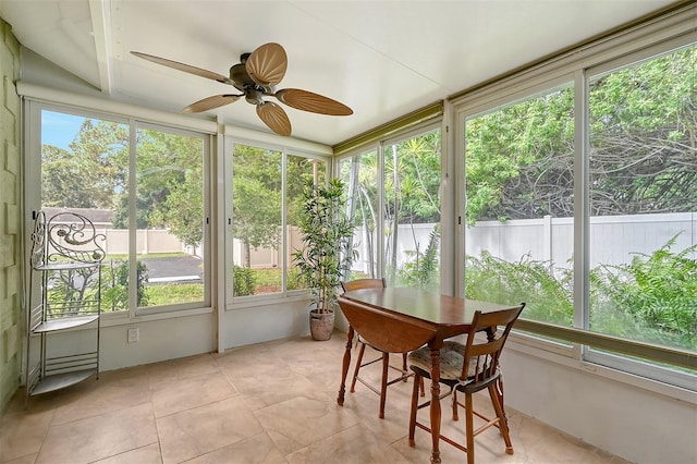 sunroom / solarium with ceiling fan