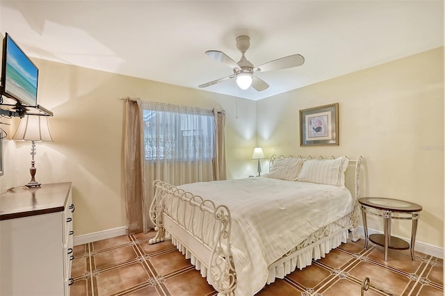 bedroom featuring tile patterned floors and ceiling fan