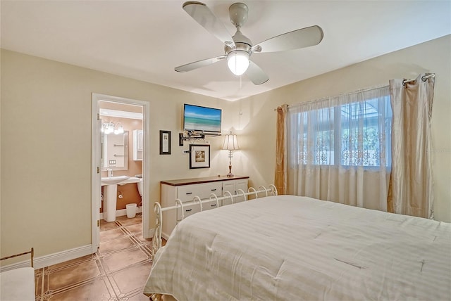 tiled bedroom with connected bathroom and ceiling fan