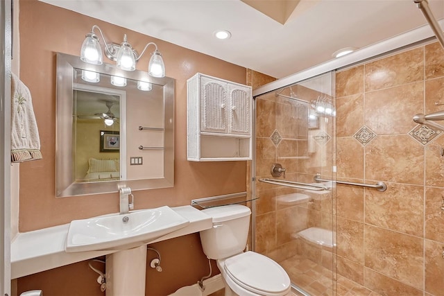 bathroom with ceiling fan, toilet, and walk in shower