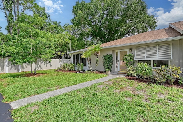 ranch-style house with a front yard