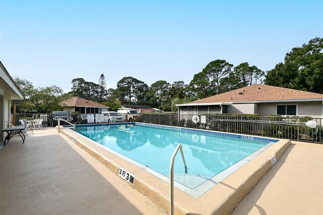 view of pool featuring a patio