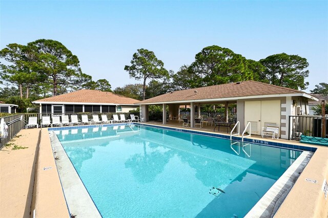 view of swimming pool with a patio