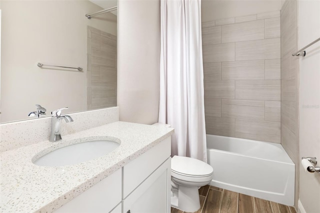 full bathroom featuring shower / tub combo with curtain, vanity, and toilet