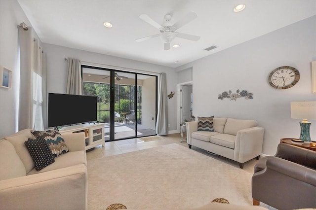 tiled living room with ceiling fan