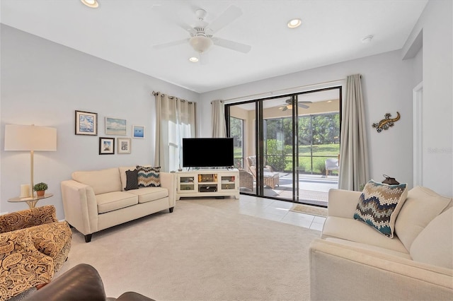 living room featuring light colored carpet and ceiling fan