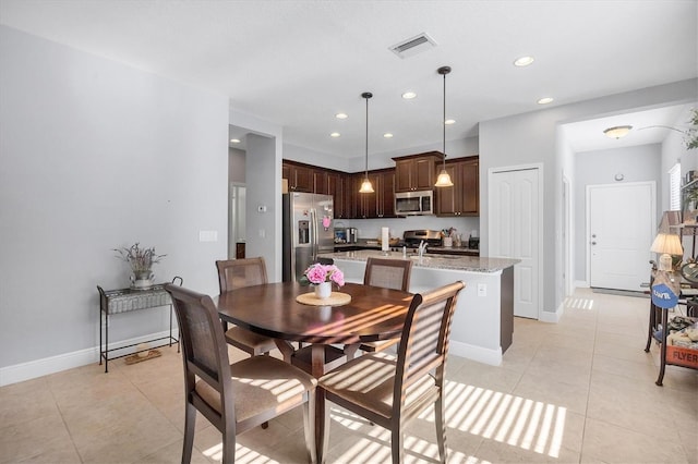 tiled dining area with sink