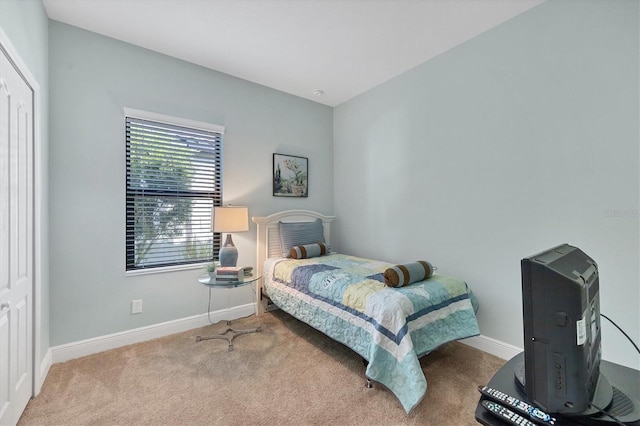 bedroom featuring light colored carpet