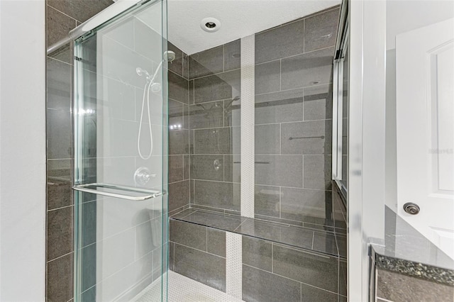 bathroom featuring an enclosed shower