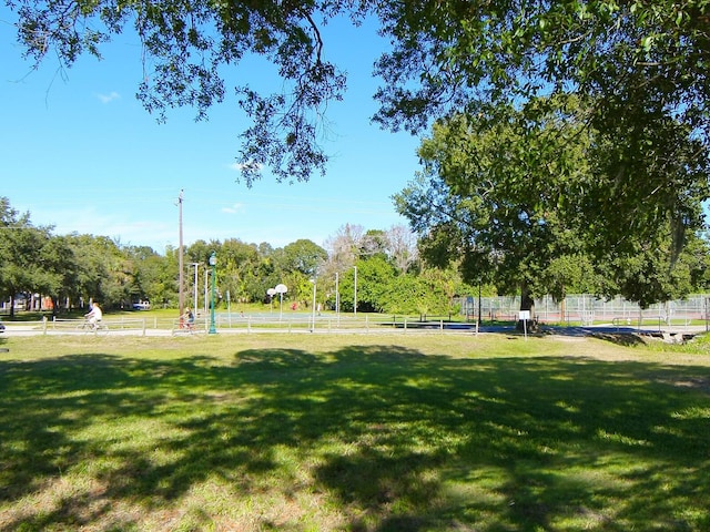 view of home's community featuring a rural view and a yard