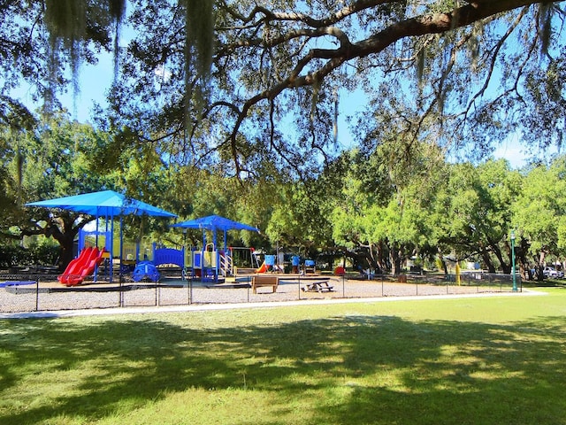 view of playground featuring a lawn