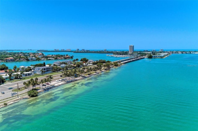 aerial view with a water view and a beach view