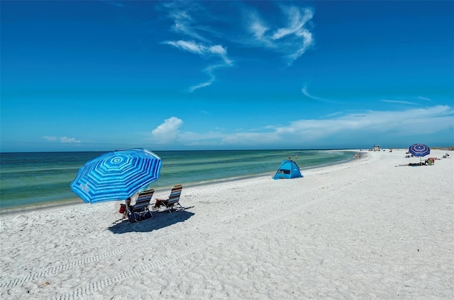 property view of water featuring a beach view