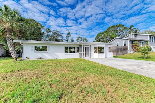 ranch-style home featuring a front yard