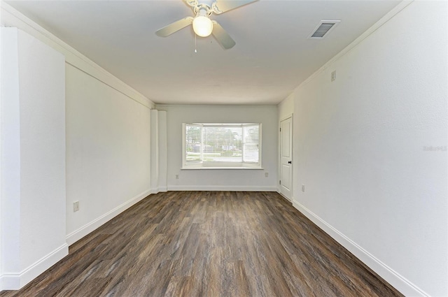 unfurnished room featuring ceiling fan, dark hardwood / wood-style flooring, and crown molding