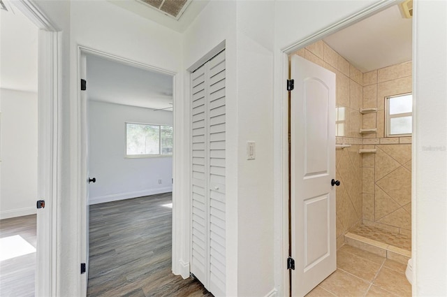 corridor featuring hardwood / wood-style flooring