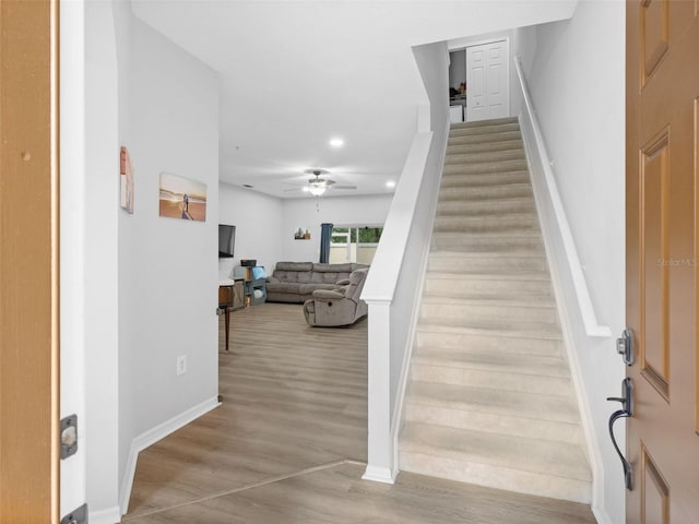 stairway with ceiling fan