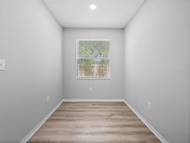 spare room with light hardwood / wood-style flooring