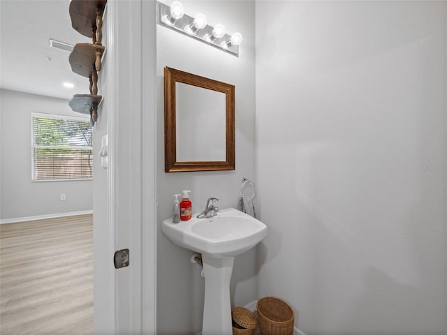 bathroom featuring hardwood / wood-style flooring