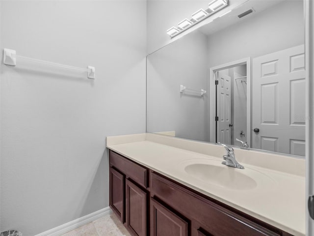 bathroom featuring tile patterned floors and vanity