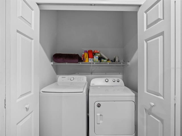 washroom with independent washer and dryer