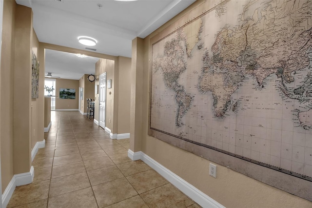 hall with light tile patterned floors