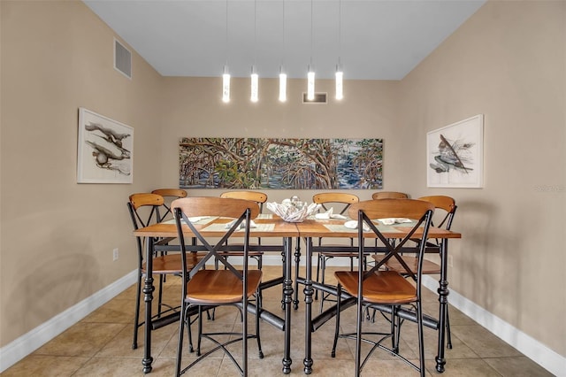 dining space with tile patterned flooring