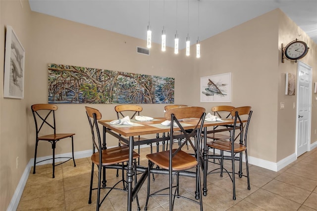 dining area featuring light tile patterned flooring