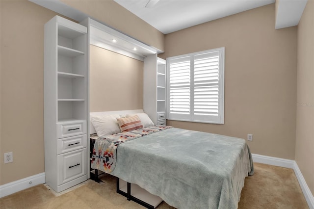 bedroom with light colored carpet