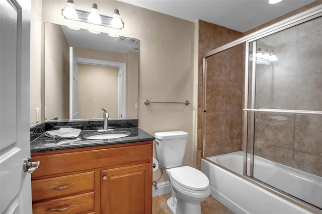 full bathroom featuring shower / bath combination with glass door, vanity, and toilet