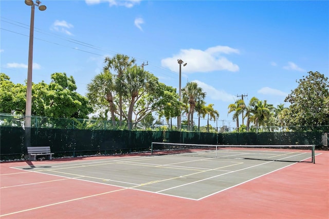 view of sport court with fence