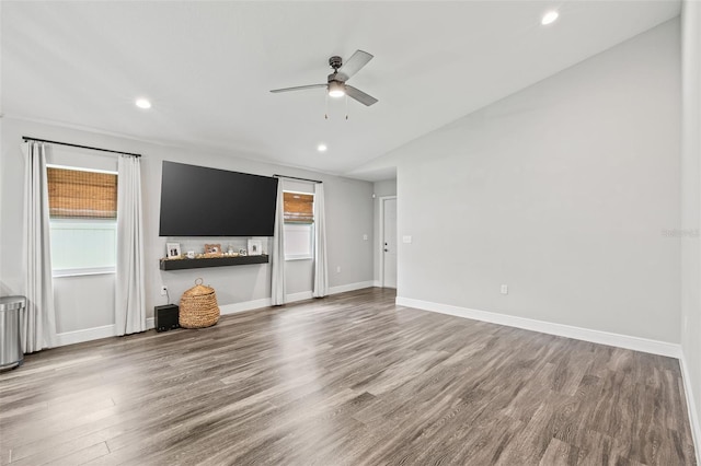 unfurnished living room featuring wood-type flooring and ceiling fan