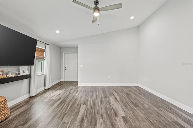 unfurnished living room featuring ceiling fan and hardwood / wood-style floors