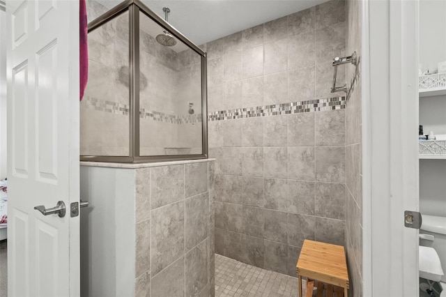 bathroom with a shower with door