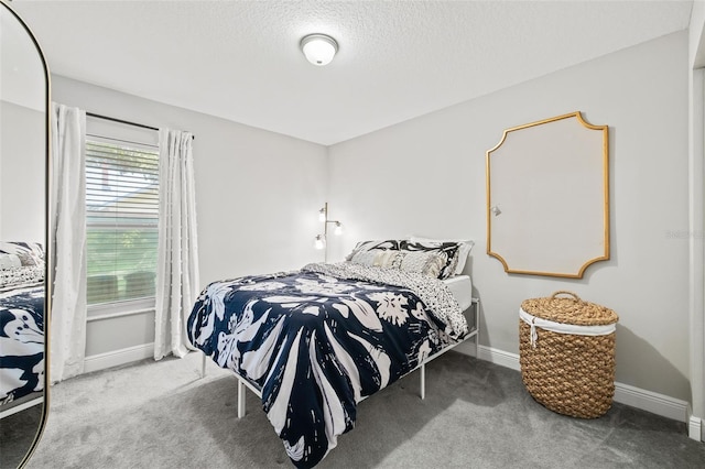 carpeted bedroom with a textured ceiling