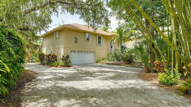 view of side of property with a garage