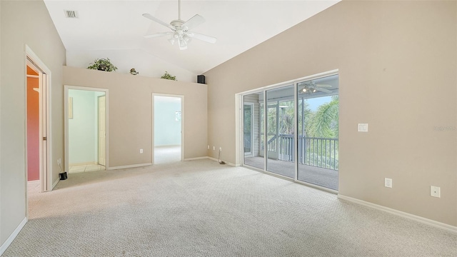 empty room featuring high vaulted ceiling, light carpet, and ceiling fan