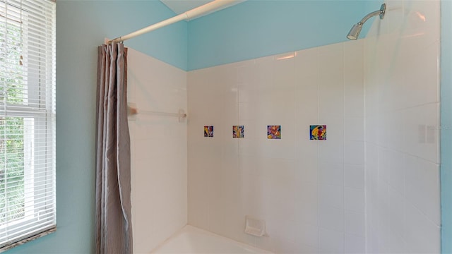 bathroom with shower / bath combination with curtain