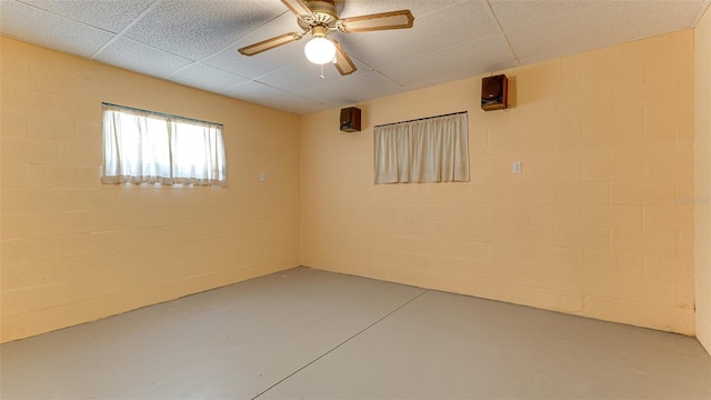 basement featuring ceiling fan