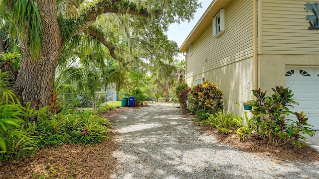 view of side of property featuring a garage