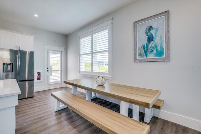 dining area with hardwood / wood-style flooring