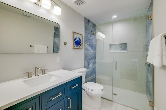 bathroom featuring vanity, toilet, and walk in shower