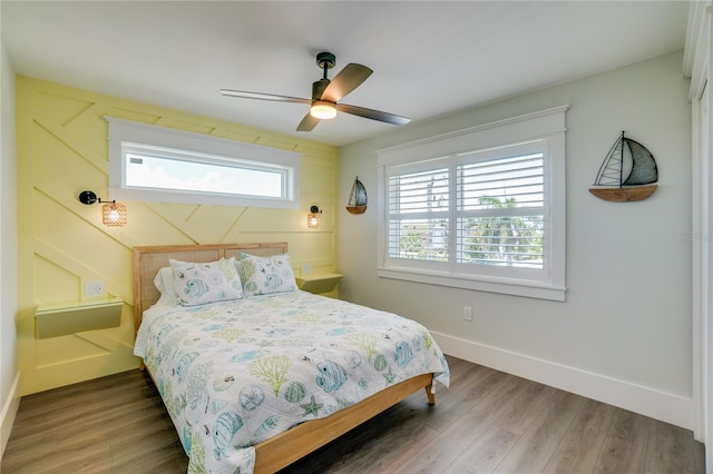 bedroom with hardwood / wood-style flooring and ceiling fan