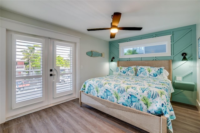 bedroom with hardwood / wood-style flooring, ceiling fan, access to exterior, and french doors