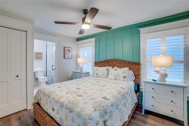 bedroom featuring connected bathroom, a closet, ceiling fan, and dark hardwood / wood-style floors