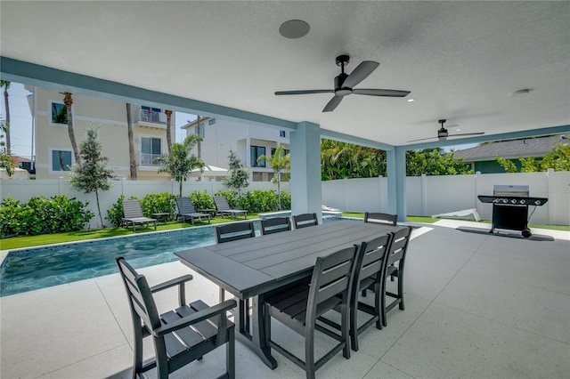 view of patio / terrace featuring a fenced in pool and grilling area