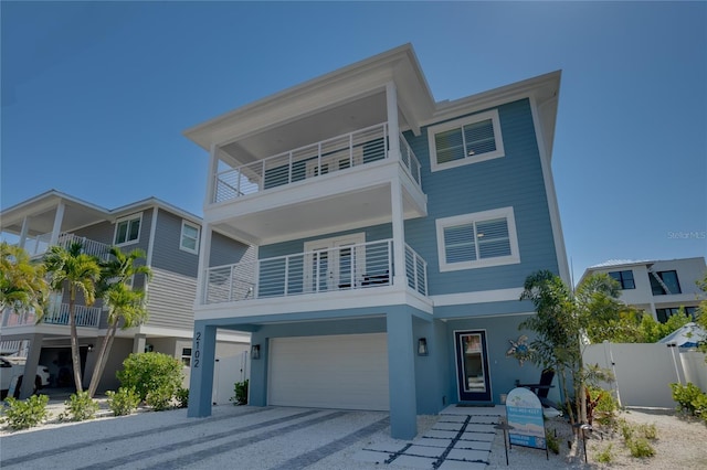 view of front of home with a balcony and a garage