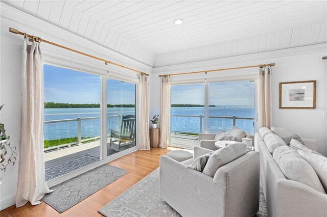 living room featuring a water view, wooden ceiling, and light hardwood / wood-style floors